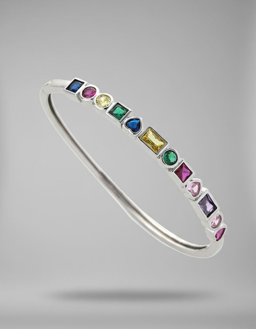 Silver bangle with multicolored gemstones on a gray background